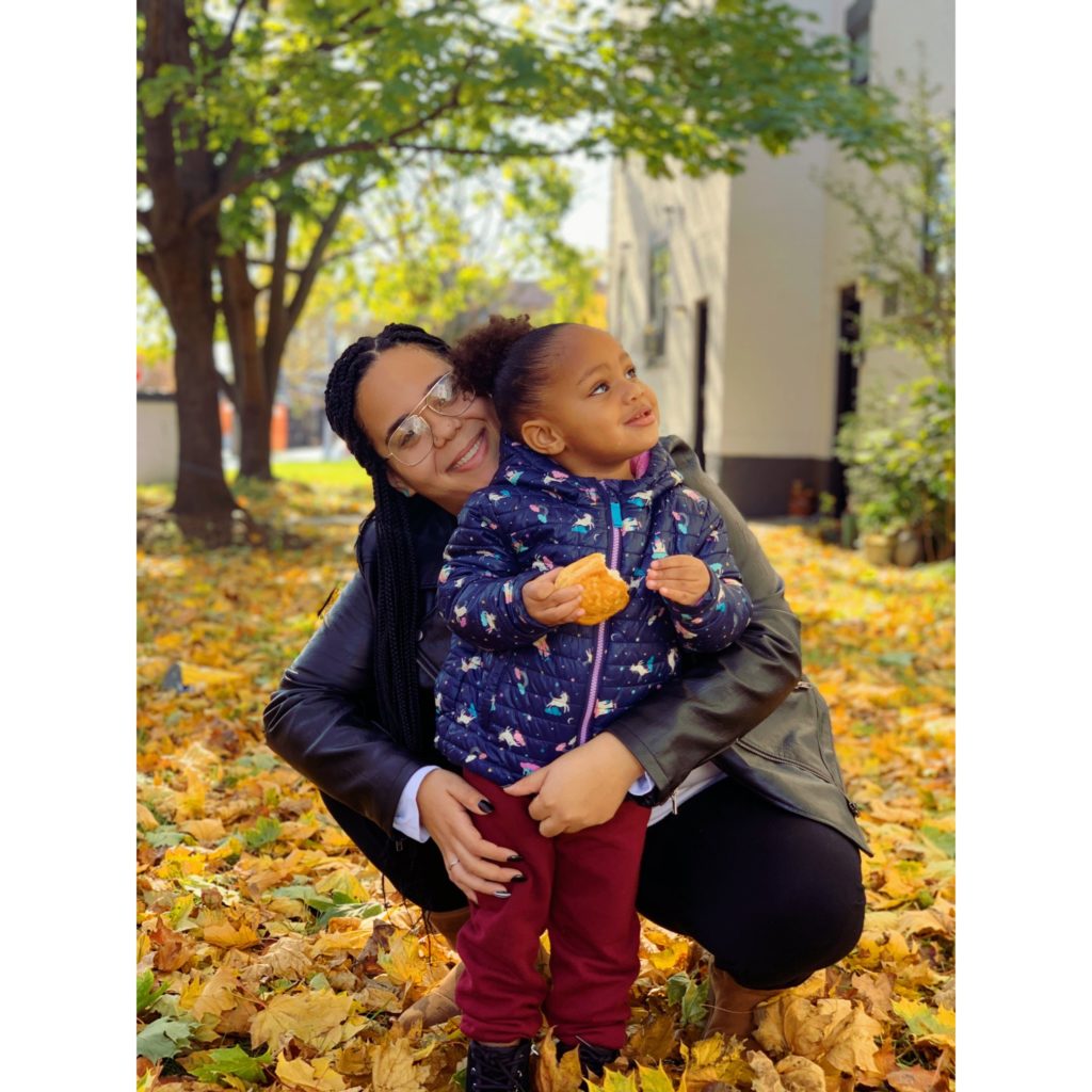 Mom and daughter hugging on a fall day