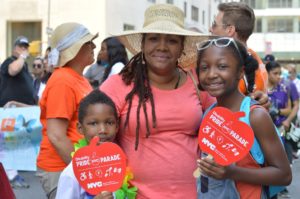Mom with kids representing at 2019 Disability Pride Parade